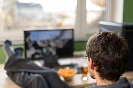 man watches video on his desktop