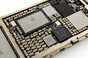  Close-up image of power management IC chip on an iPhone 6 logic board.