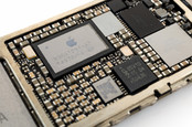  Close-up image of power management IC chip on an iPhone 6 logic board.