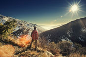 a hiker pauses on top of the sierra nevada mountains