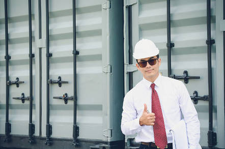 An inspector in a white hat