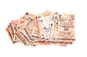 SWINDON, UK - MARCH 4, 2016: A row of Losing lottery tickets on a white background
