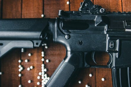 Airsoft rifle closeup with pellets