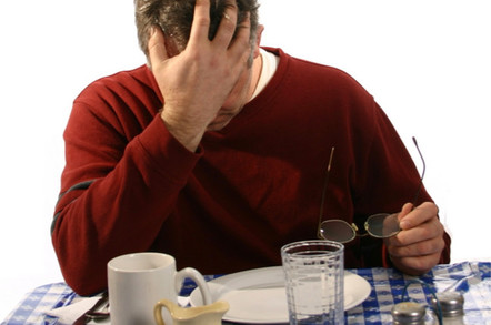 depressed man dines at empty plate