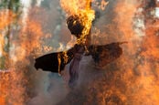 "witch" Effigy burns..