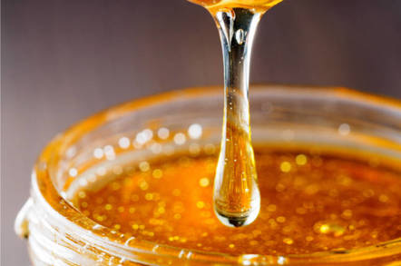 Syrup flows into jar