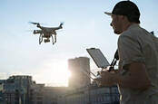 A man flying a drone. Pic: Shutterstock