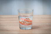 false teeth in glass