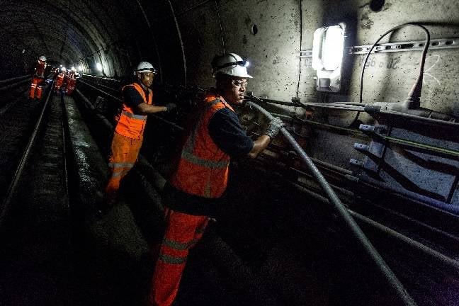 Installing cables in Tube tunnel