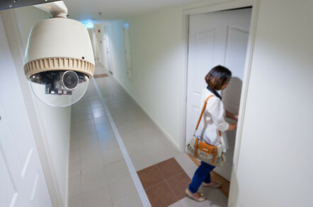 woman on camera as she enters her home