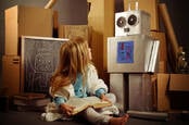child with cardboard robot