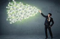 man in suit magically impels cloud of money towards an unseen source.