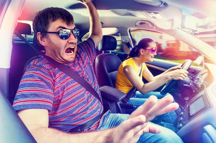 A car passenger not enjoying the drive
