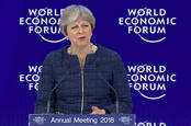 Brit Prime Minister theresa may at a podium