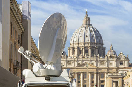 A picture of a satellite dish next to St Peter's Dome