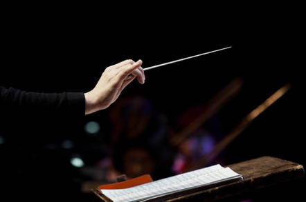 conductor's hand on a black background