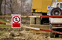 Boom across construction area with sign denying walkers access 
