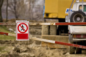 Boom across construction area with sign denying walkers access 