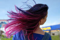 Woman with fuchsia, purple, pink hair