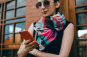 hipster girl in scarf on phone