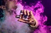 Person holding vape box