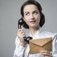 woman on vintage rotary telephone 1950s