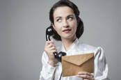 woman on vintage rotary telephone 1950s