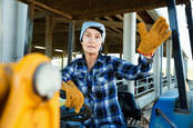  farmer sitting on a tractor at the cowfarm