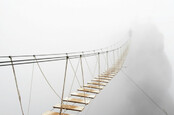Shutterstock Rope Bridge Mist Man Walking