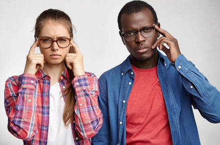 Two annoyed looking people are not looking to participate