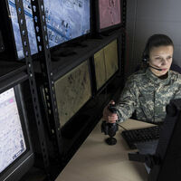 military staffer looks at monitor (drones)