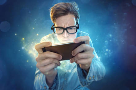 Man looks into his cellphone/mobile - which looks back at him