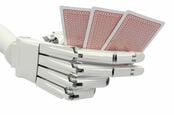 Robot hand holding cards