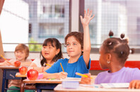 Kid raising hand in school