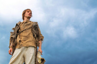young man in medieval peasant costume
