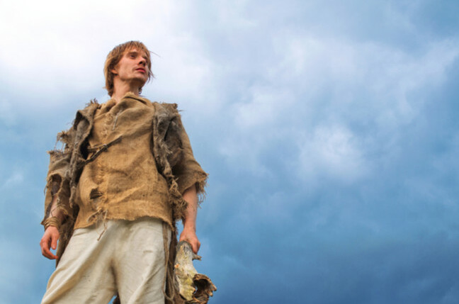 young man in medieval peasant costume