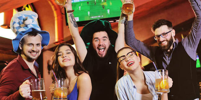 Friends with beer watching TV