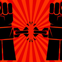 Hands with clenched fists breaking bonds or fetters