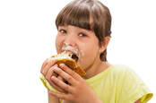 A kid eating a cake