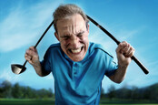 An angry, frustrated golfer bends a club over his head