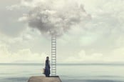 A woman standing by a ladder to a cloud