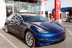 California January 6, 2018: navy tesla model 3 charging at supercharger station Aleksei Potov / Shutterstock.com