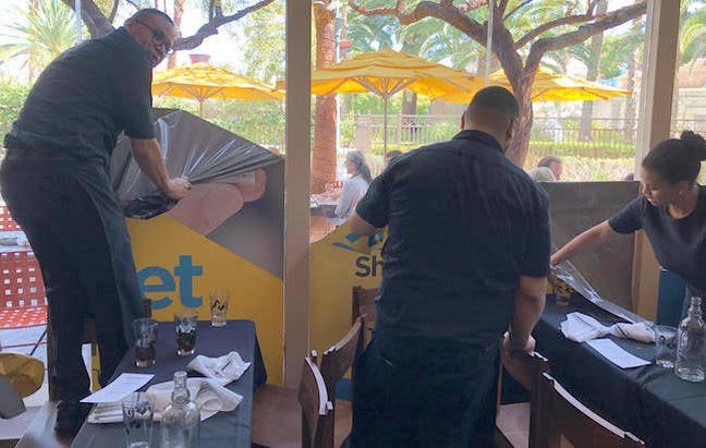 Restaurant staff tearing down IGEL's branding near VMworld 2018