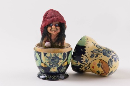 A troll emerging from a nesting doll