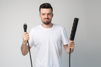 Man holding plug socket