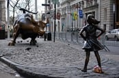 Statue of girl confronting Wall Street bull