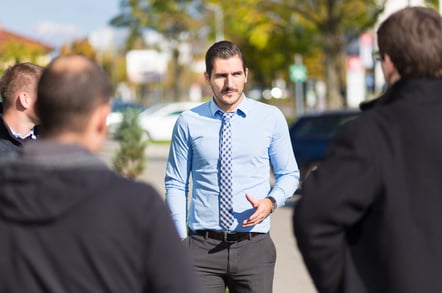 Businessman being approached and blackmailed by racketeers