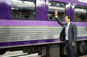 Suit waves goodbye to train