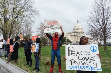 Anti-Facebook protesters await the arrival of Mark Zuckerberg on Capitol Hill for another day of testifying.