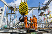 People working with a crane